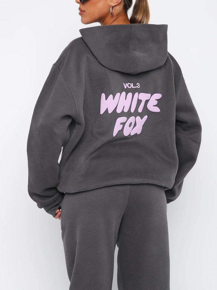 Cropped hoodie and joggers for women, stylish matching set with a distinctive graphic back print.