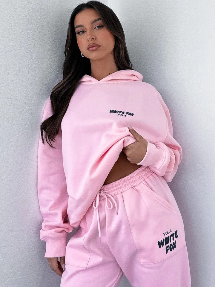 Her cropped hooded tracksuit, comfortable jogger set with a stand-out unique back print.