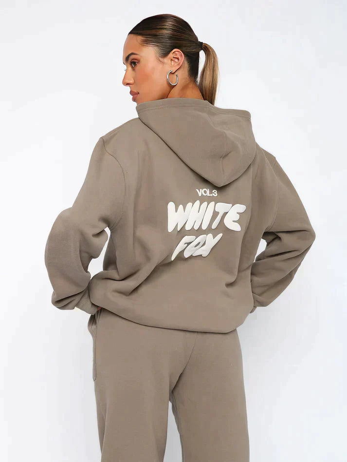 Matching women's cropped hoodie and jogger set, casual and trendy with a unique back print.