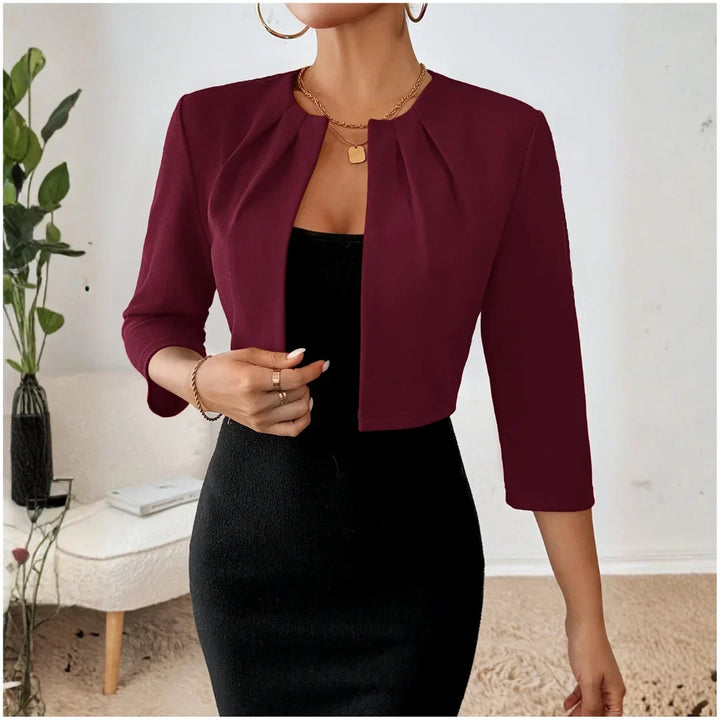 Classic women's open front blazer, cropped fit, 3/4 sleeves, & elegant pleats for a refined, versatile look.