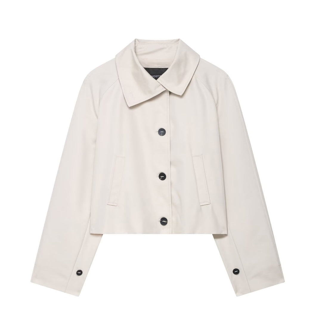 Modern women's cropped jacket featuring a relaxed fit and button front, versatile for spring and autumn style.
