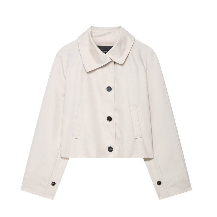 Modern women's cropped jacket featuring a relaxed fit and button front, versatile for spring and autumn style.