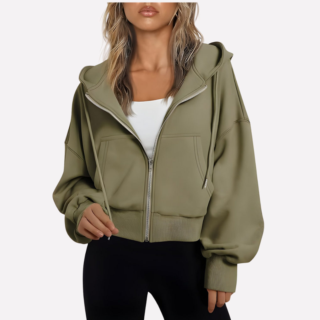 Women's cropped zip hoodie with relaxed fit and drawstring, perfect for casual layering.