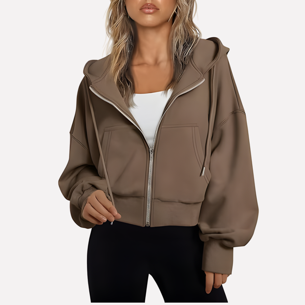 Chic women's outerwear: a cropped zip hoodie with drawstring, perfect for a modern look.