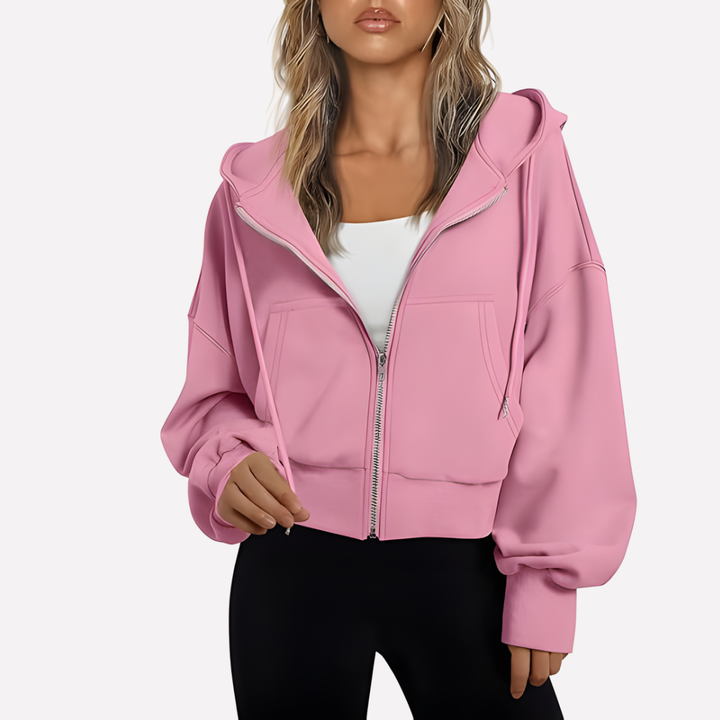 Modern women's cropped zip-up hoodie, featuring a relaxed fit and adjustable drawstring.