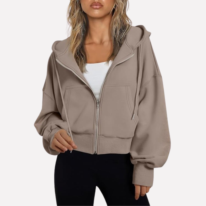 Comfortable women's cropped zip-up hoodie, featuring a stylish drawstring and relaxed fit.
