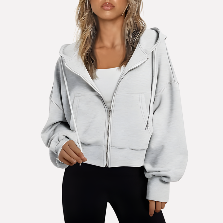 Versatile women's cropped hoodie with zip closure and drawstring, great for casual wear.