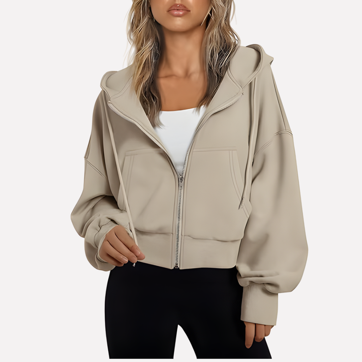 Relaxed fit women's cropped zip jacket, a comfortable and modern drawstring hoodie.
