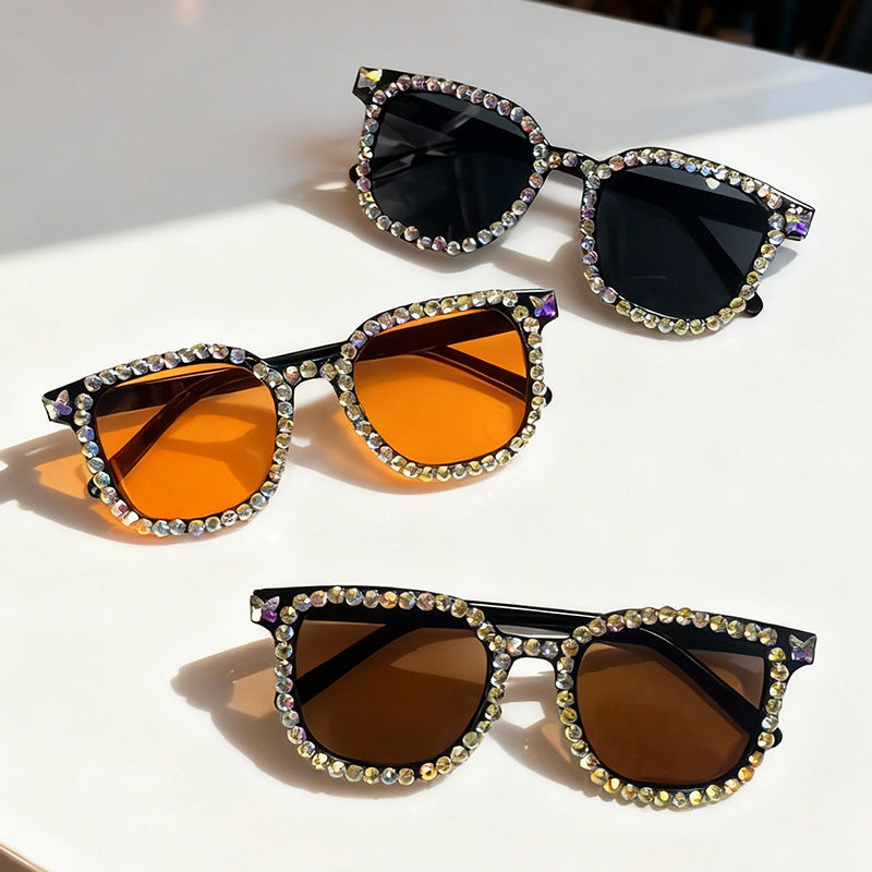 Glamorous women's cat eye sunglasses featuring crystal embellishments, perfect for fashion.