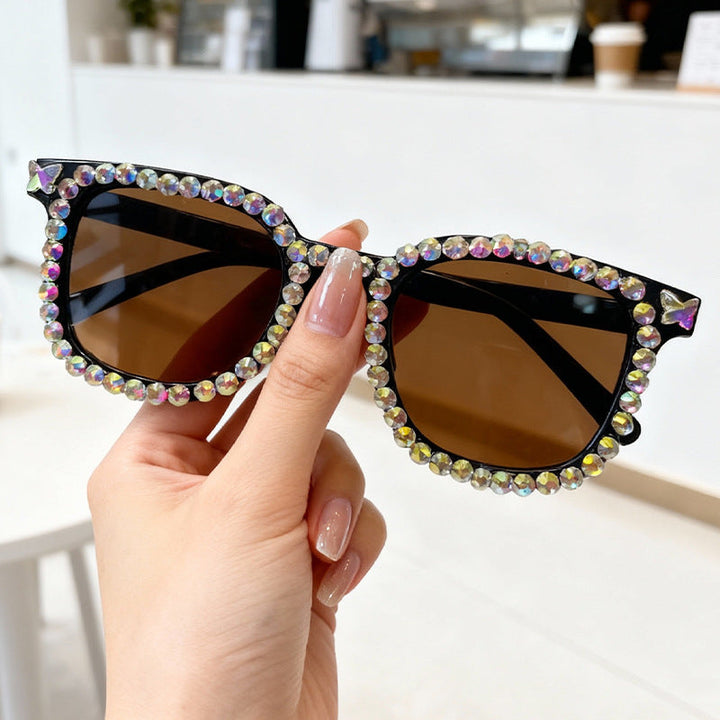 Trendy women's cat eye sunglasses with dazzling crystal embellishments, ideal fashion eyewear.