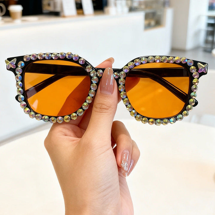Luxurious women's cat eye sunglasses, crystal-embellished for a glamorous look and UV protection.