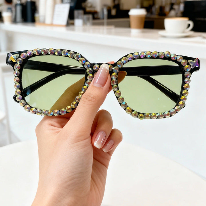 Modern women's cat eye sunglasses with crystal detailing, combining chic fashion with UV protection eyewear.