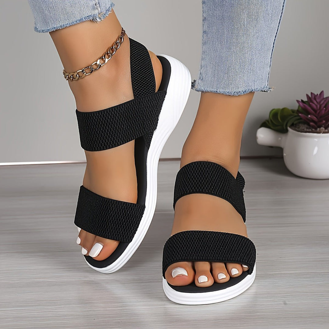 Everyday women's platform sandals, offering soft cushioning and elastic cross-straps for ultimate comfort.