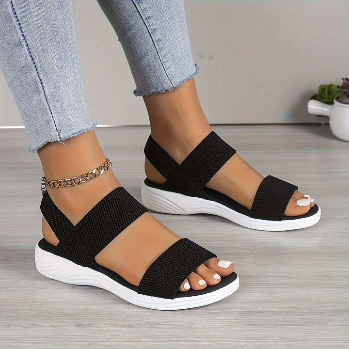 Comfortable women's platform sandals featuring soft cushioning and stylish cross-straps, perfect for summer.