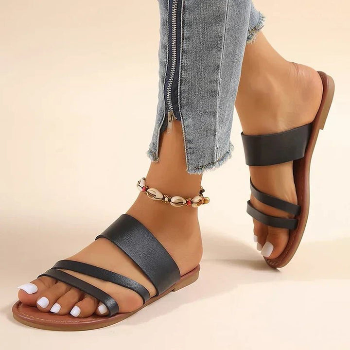 Women's cushioned cross-strap slip-on comfort sandals, ideal for everyday summer wear.