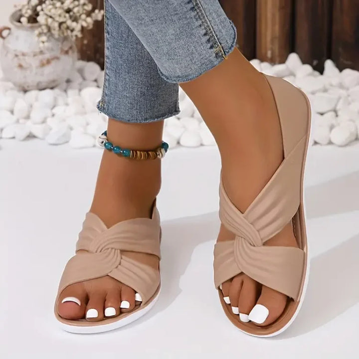 Comfortable women's crossover sandals with excellent arch support, ideal for casual wear.