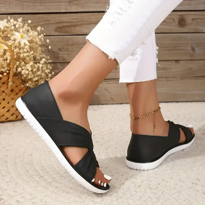 Women's cushioned crossover slip-on sandals, blue, for stylish, comfortable summer walking.