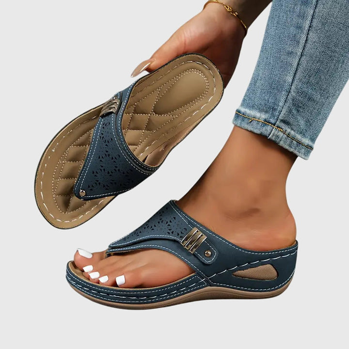 Chic women's orthopedic slide sandals with arch support. Cushioned wedge for all-day comfort & casual walking.