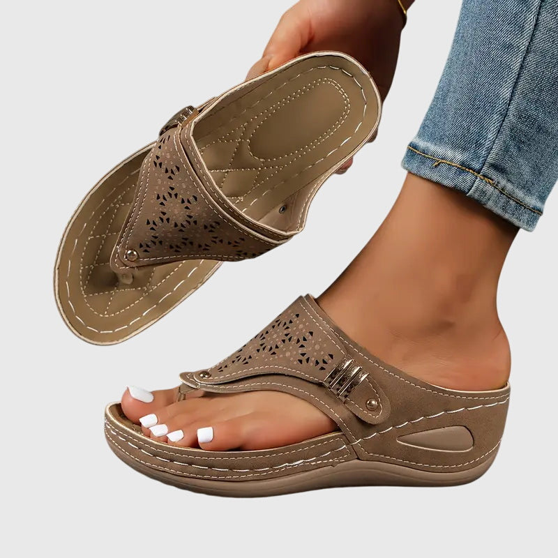 Everyday women's slide sandals, designed for orthopedic comfort. Features a stable wedge & soft cushioning.