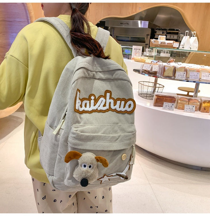 Stylish women's fashion backpack, featuring unique appliqué designs for a fun, casual look. Ideal for school or day trips.