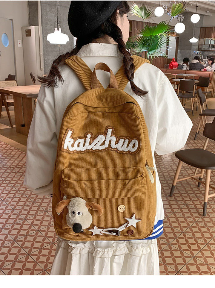 Casual women's daypack with adorable appliqué patches, great for everyday carry or as a cute school bag.