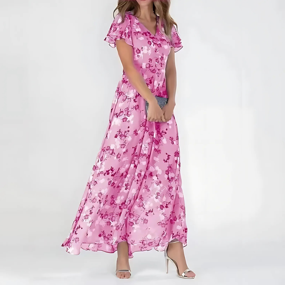 Lightweight women's floral summer dress featuring a vibrant daisy pattern. Comfortable, breezy design for warm weather.
