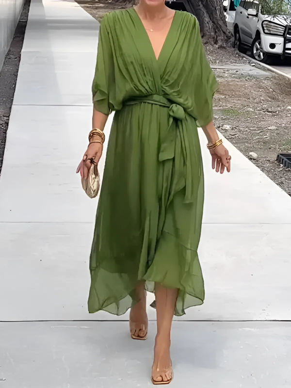 Women's daisy print midi dress with flutter sleeves and a tie waist, perfect for summer casual wear.