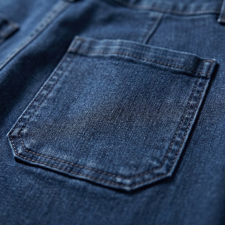 Elegant women's dark wash A-line skirt, knee-length design with practical patch pockets for a chic, modest look.