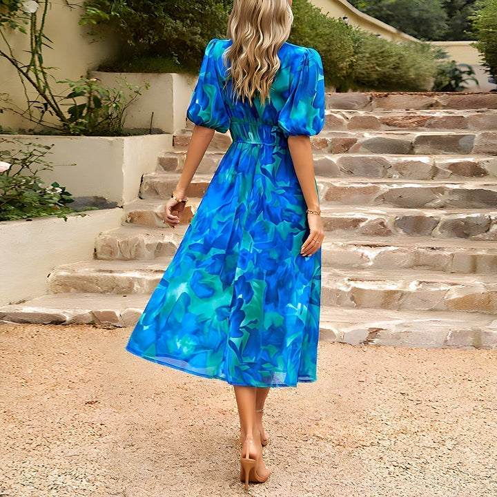 Beautiful women's floral midi dress with V-neck, perfect for summer fashion. Elegant Daydream print.