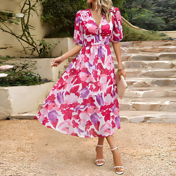 Daydream style women's midi dress with a flattering V-neck. Elegant floral print, flowy for spring/summer fashion.