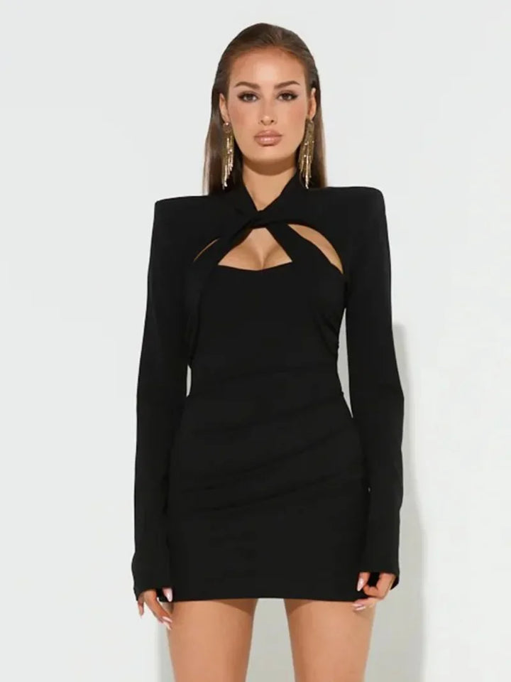 Chic women's black embellished long sleeve cocktail dress. Dazzling cut out detail makes it perfect for parties.
