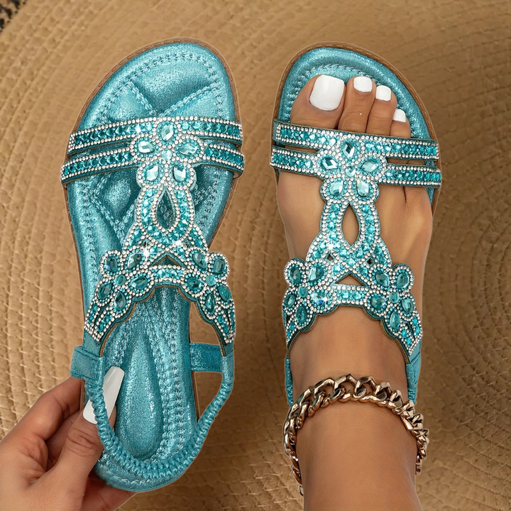 Women's dazzling rhinestone flat sandals for summer comfort & glamour.