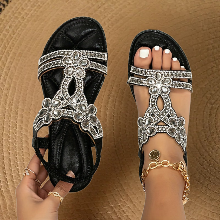 Dazzling crystal-embellished women's flat sandals with a comfortable open-toe design for summer.