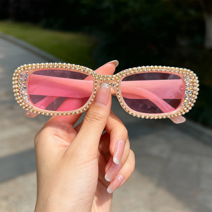 Women's dazzling rhinestone oversized fashion sunglasses, offering glamour & UV protection.