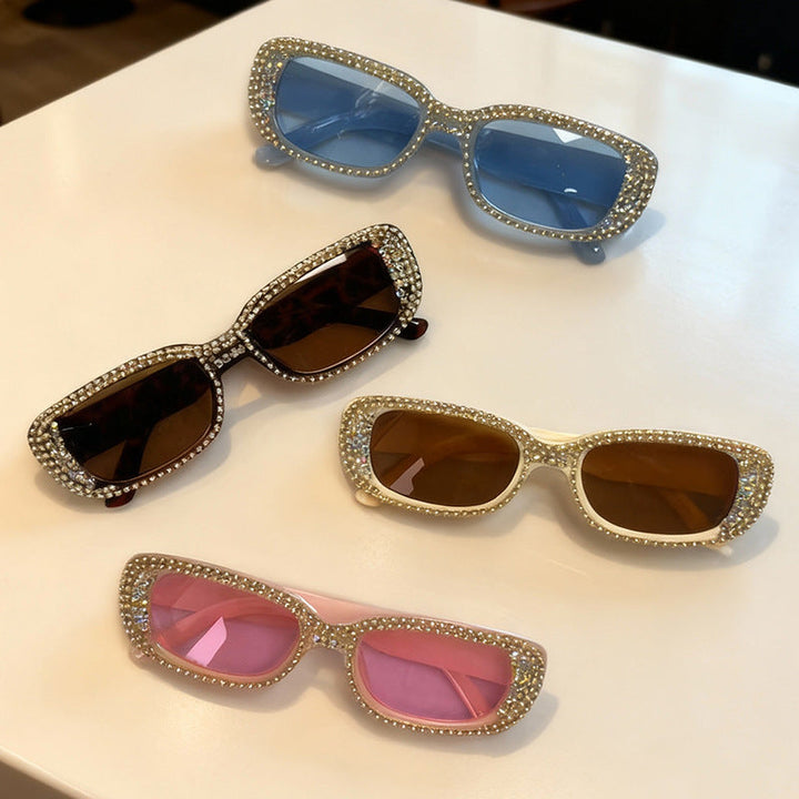 Elegant women's oversized sunglasses with dazzling rhinestone accents, enhancing your stylish fashion look.