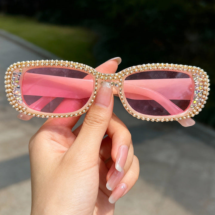 Trendy women's oversized rhinestone eyewear with UV protection, a stylish and dazzling fashion accessory.