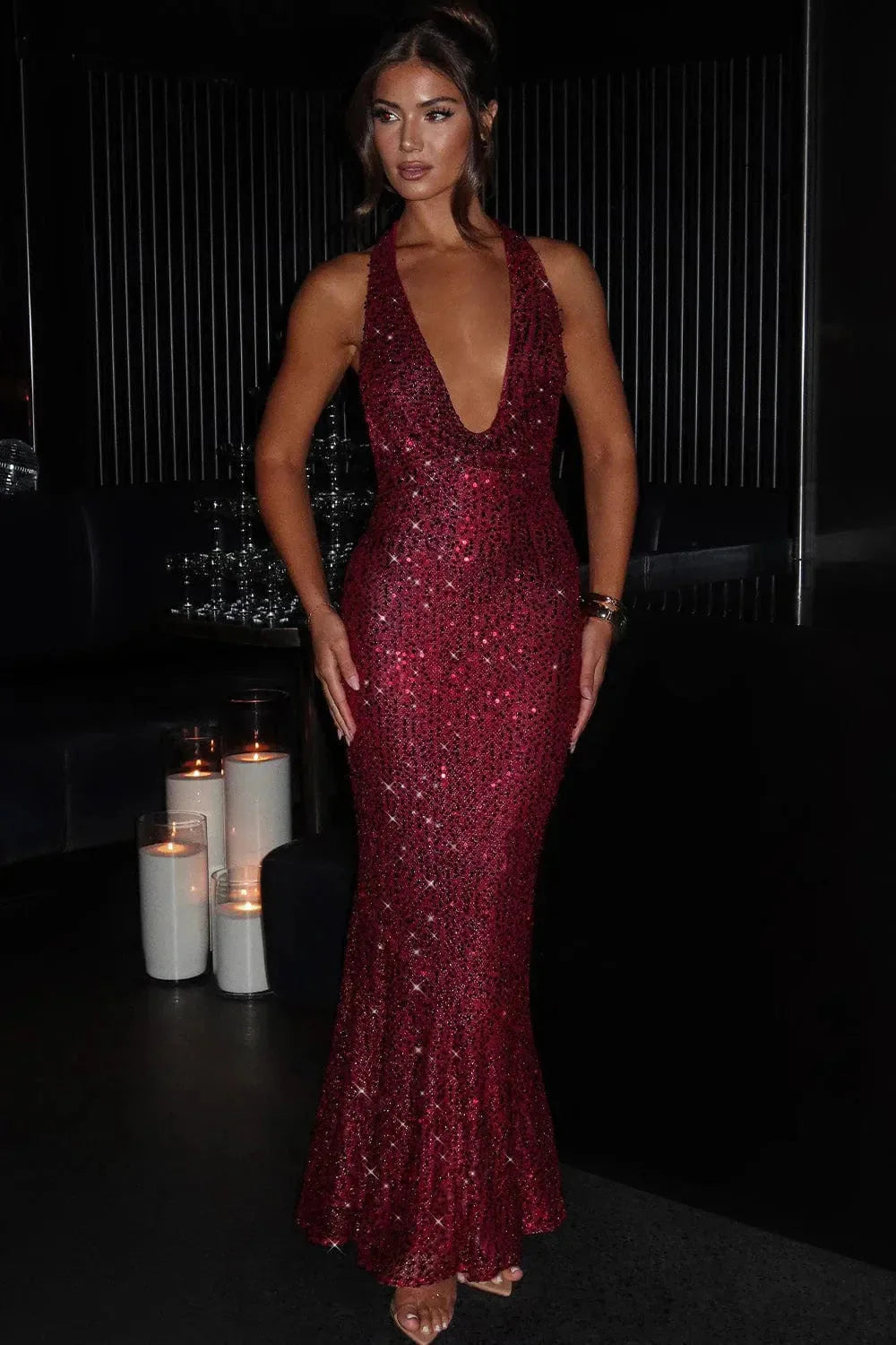 Women's party-ready sequin dress, an elegant halter neck maxi gown for dazzling nights.