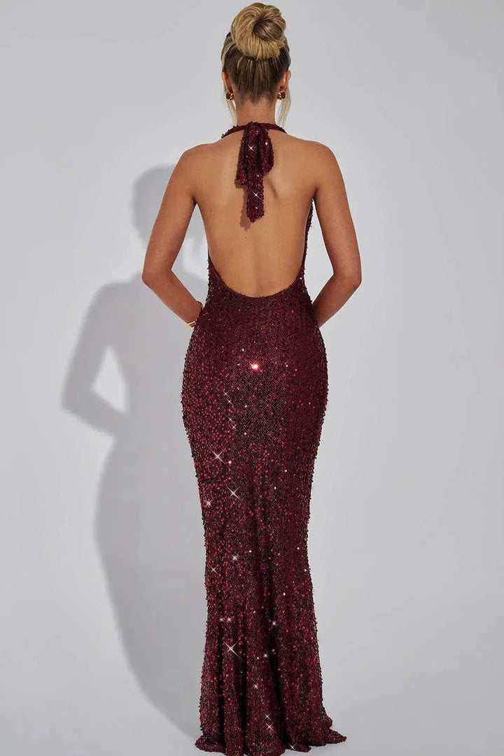 Women's elegant sequin maxi dress, featuring a chic open back and a dazzling finish.