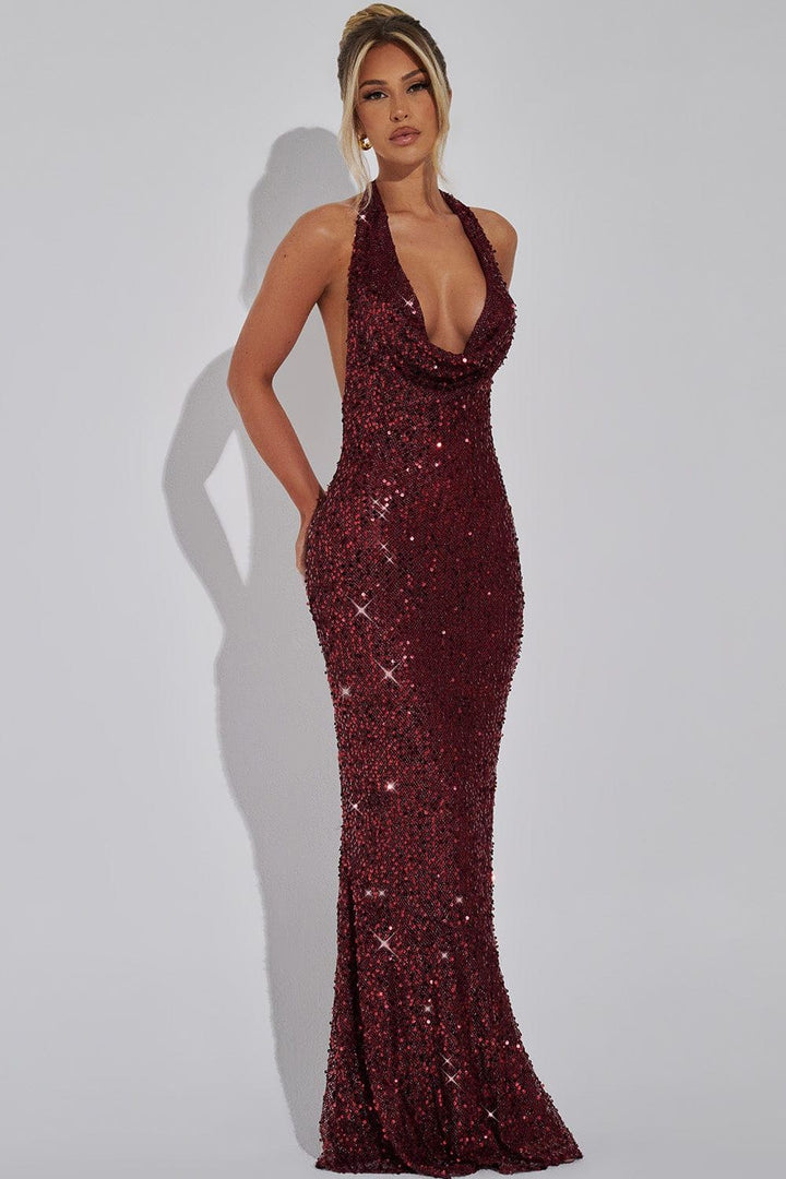 Shimmering women's sequin halter dress, an eye-catching outfit for evening occasions.