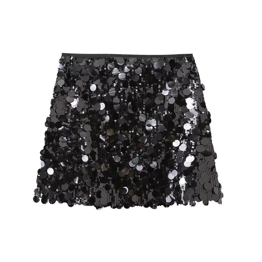 Fashionable women's sparkling sequin mini skirt, a dazzling statement piece for parties.