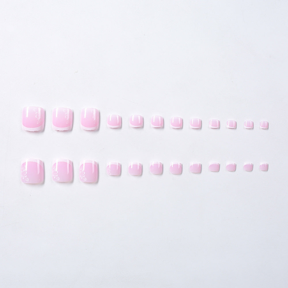Elegant French tip toenail art. Decorative press-on artificial nails for a beautiful and quick DIY pedicure.