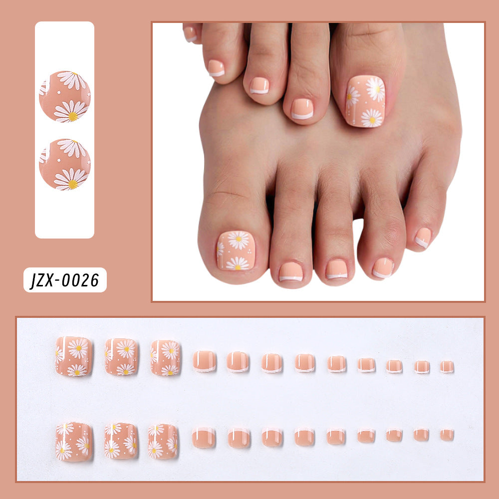 Salon-quality French tip press-on toenails for women. Decorative and easy to apply for instant beauty.