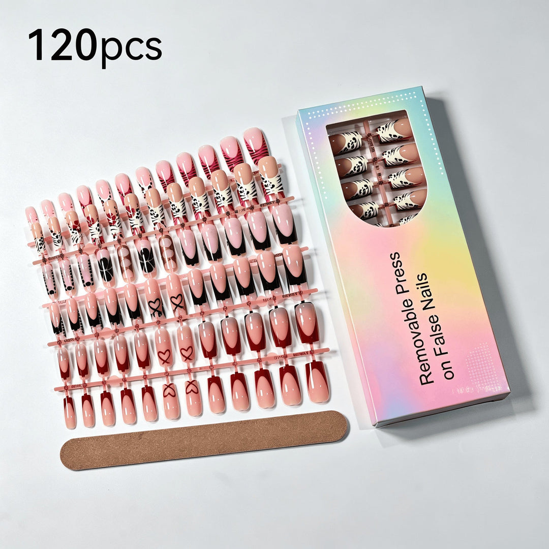 Full set of reusable press-on nails for women, featuring intricate decorative patterns for a stunning and easy nail art application.