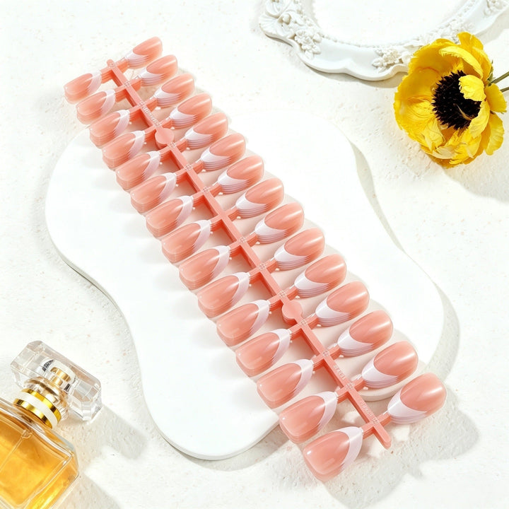 Colorful press-on nail tips with intricate designs for women's nail art. Achieve a decorative instant manicure.