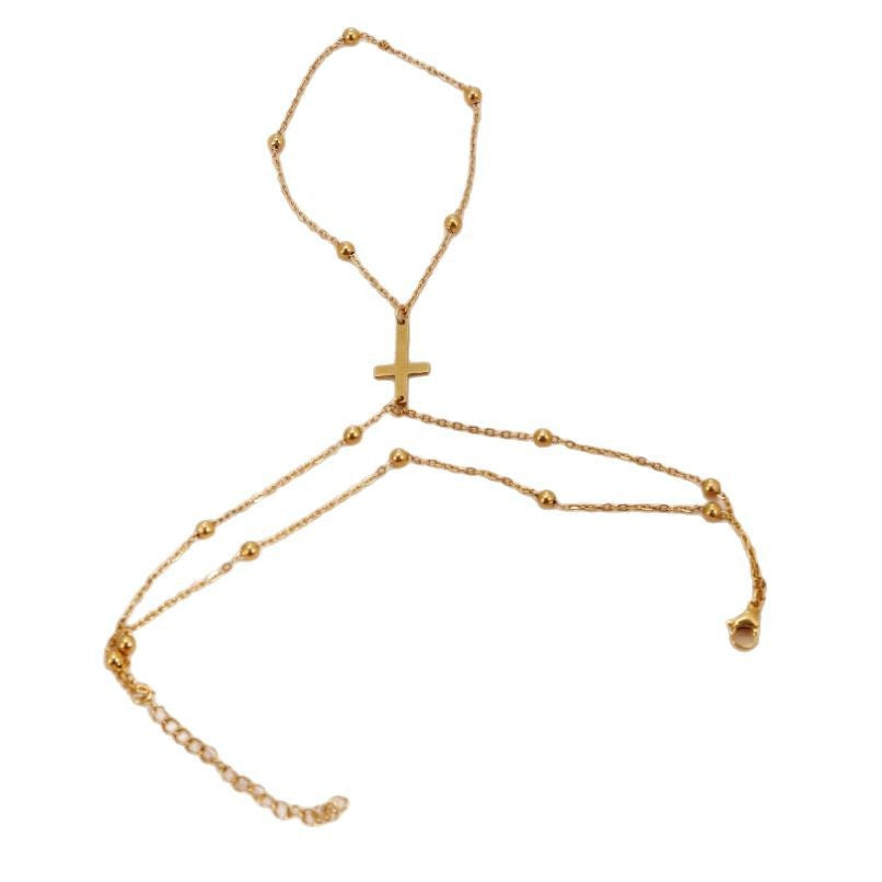 Rose gold adjustable cross charm bracelet for women, a stylish and delicate religious gift or faith jewelry.