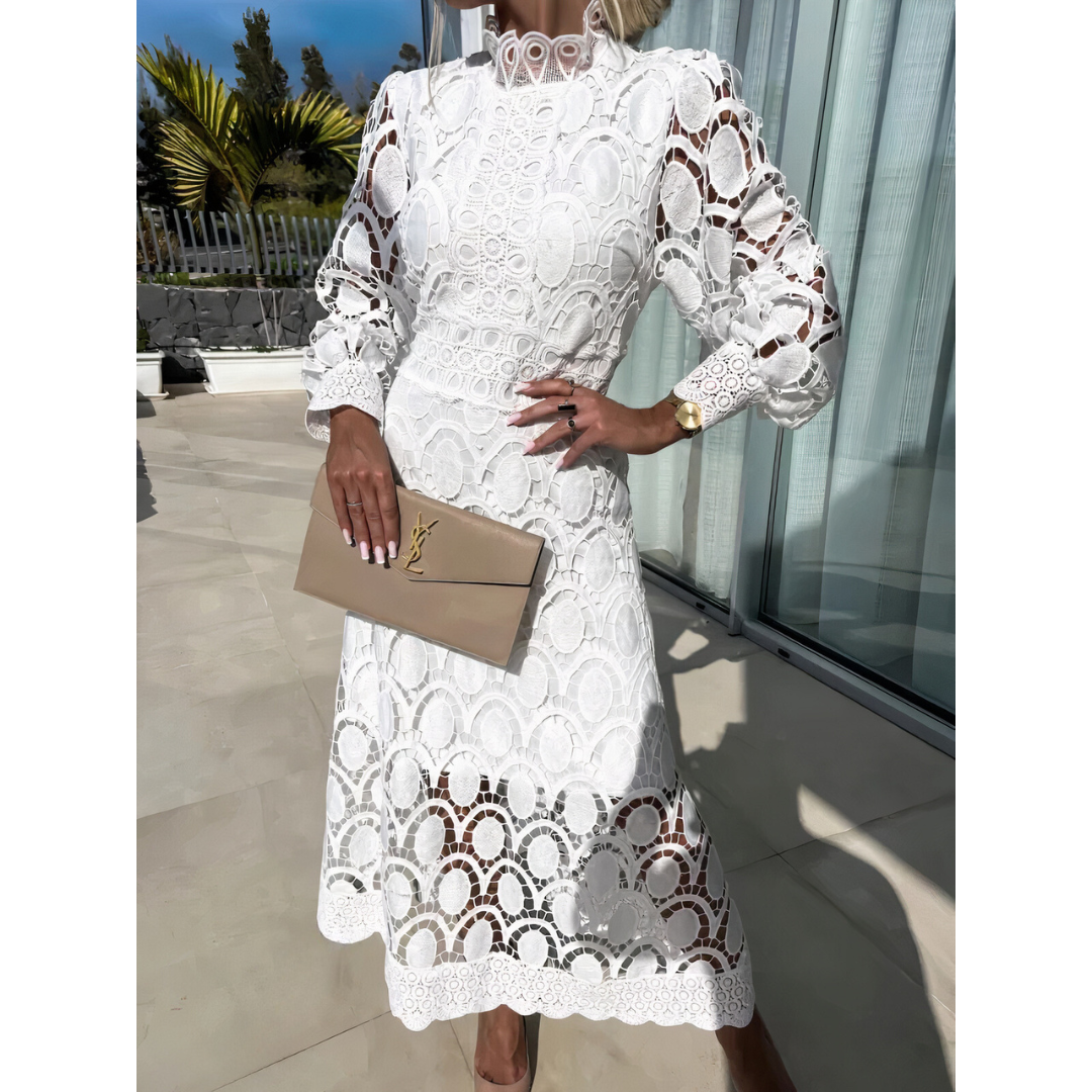 Women's delicate lace midi dress, long sleeves & sheer details, perfect for elegant evening wear.