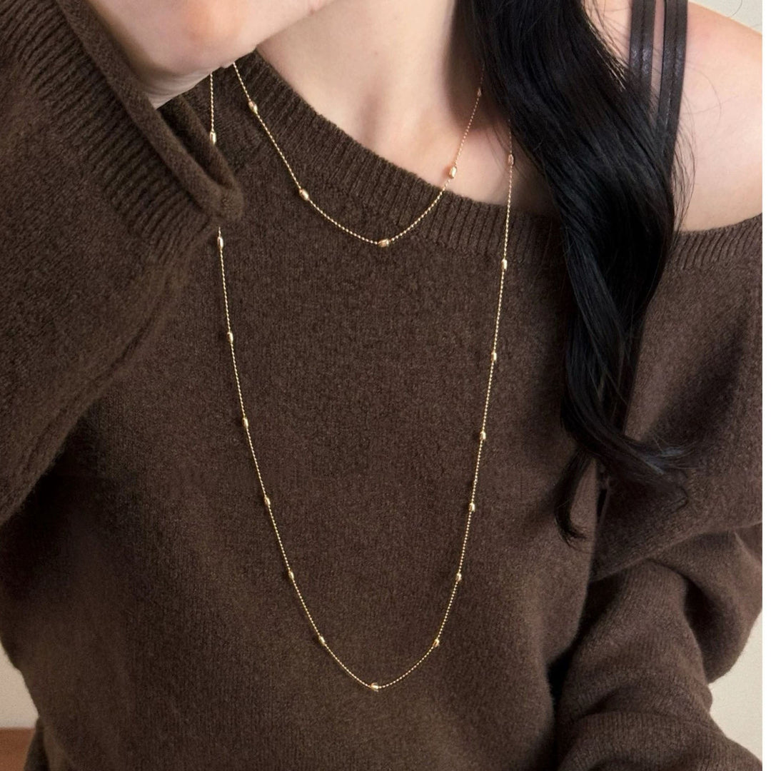 Gold-plated delicate layered chain necklace for women, a stylish fashion jewelry accessory.