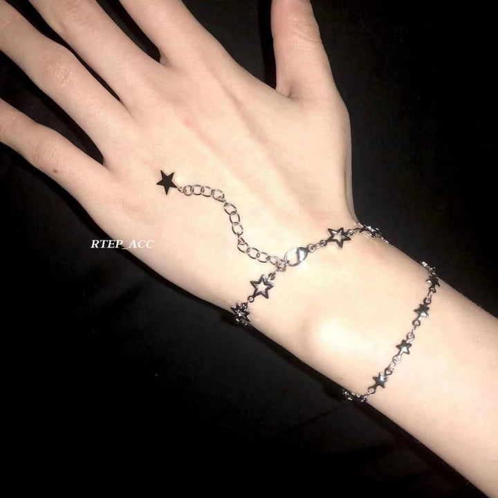 Women's delicate star accented chain bracelet. Adjustable celestial jewelry, a perfect fashion accessory or gift for her.