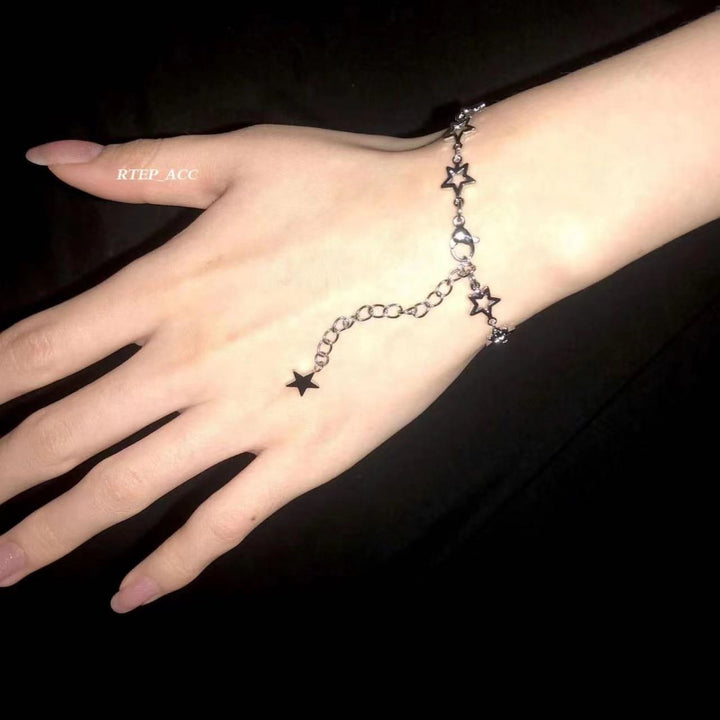 Close-up of elegant women's star bracelet. Delicate chain, celestial design, a chic fashion accessory for women.