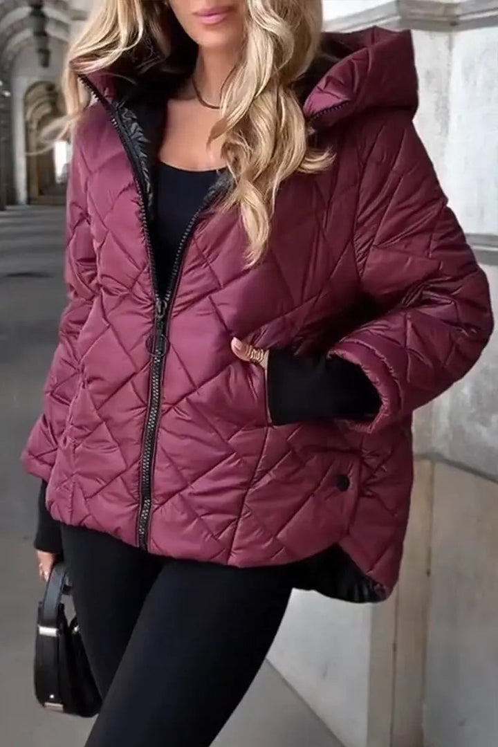 Diamond quilted women's puffer jacket, hooded & zip-up design. Warm and stylish winter coat for women.